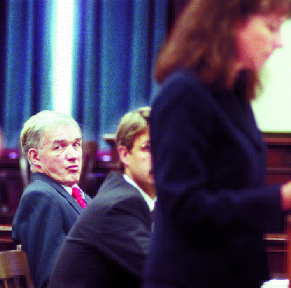 Albert Cochran, left, listens during a September 1998 court hearing on his murder change at Somerset County court in Skowhegan. Next to him are defense lawyers John Pelletier and Michaela Murphy at podium. Police are searching wells in central Maine for the remains of Pauline Rourke, Cochran's live-in girlfriend, who disappeared two weeks after Janet Baxter was murdered in 1976.