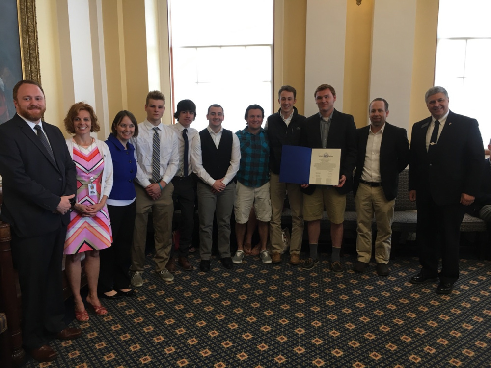 The Maine Senate recognized the Maine Moose U18 team, based in Hallowell, on June 14 for their victory at the 2017 Tier 2A USA National Hockey Championship in Lansing, Michigan. From left are Sen. Nate Libby, D-Lewiston; Sen. Amy Volk, R-Scarborough; Sen. Shenna Bellows, D-Manchester; Jeromy Rancourt, Tanner McClure, Matthew Deveaux, Tyler Wheeler, Thomas Arps, Gavin Bates, Coach Jeff Ross and Sen. Scott Cyrway, R-Benton.