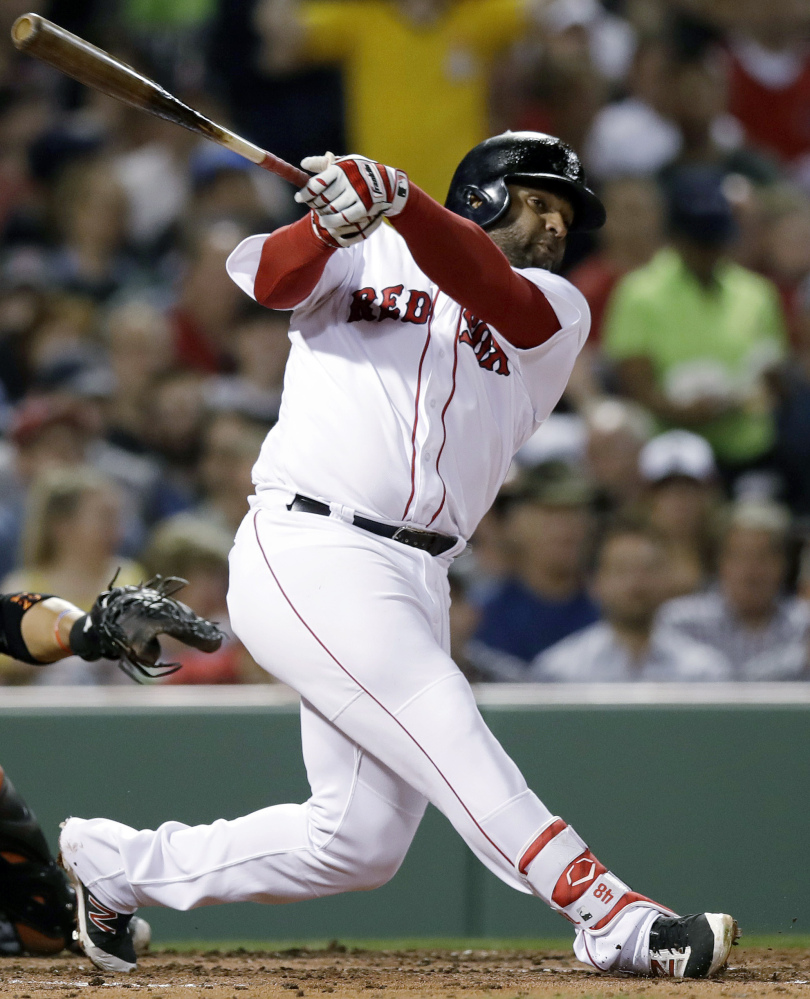 In this April 11 photo, Boston third baseman Pablo Sandoval swings during the second inning against the Orioles at Fenway Park in Boston.
