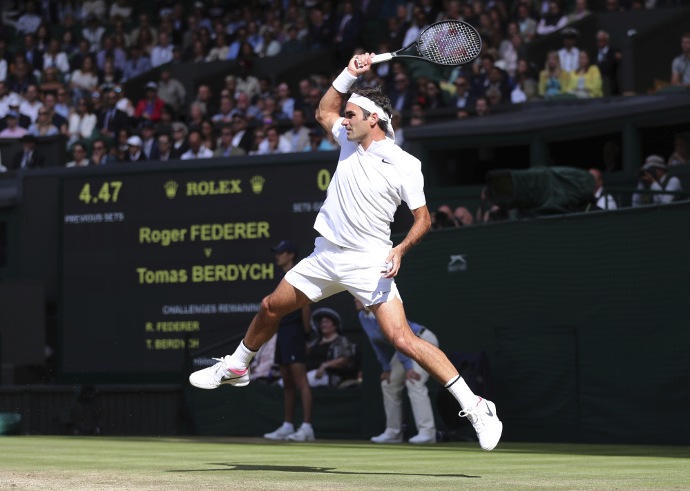 Roger Federer returns to Tomas Berdych during their Wimbledon semifinal match Friday in London.