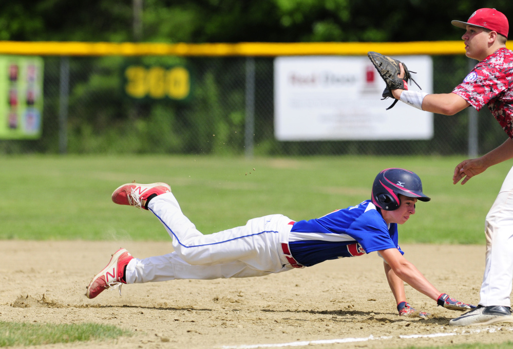 Augusta's Kyle Douin dives safely back to first base as South Portland first baseman Tyler Small waits for the throw during a 14U Babe Ruth All-Star game at McGuire Field on Friday in Augusta.