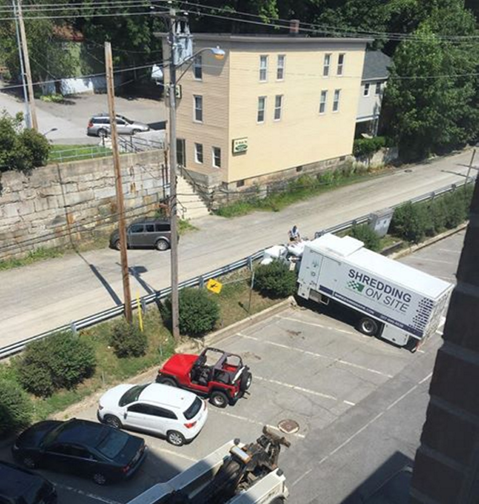 A Shredding On Site truck rolled across the street and into a cement wall Monday morning in Augusta.