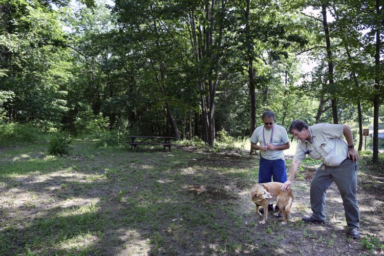 Mike Firlotte and Doug Clark confer Monday on the Harrison Avenue Nature Trail near Firlotte's home in Gardiner.