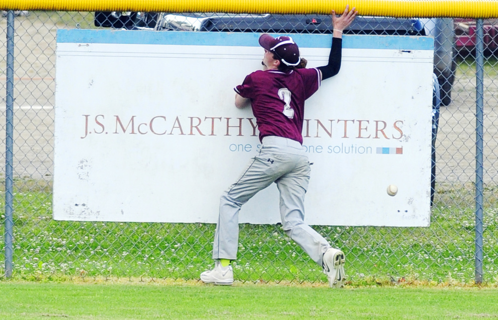 Franklin center fielder David McDonald hits the Morton Field fance chasing a long fly ball during a Zone 2 playoff game Tuesday in Augusta.