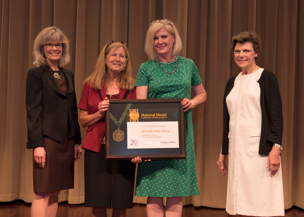 Institute of Museum and Library Services presented the National Medal for Museum and Library Service to Waterville Public Library at the National Archives on July 17. The National Medal is the nation's highest honor given to museums and libraries for service to the community. From left are Institute of Museum and Library Services Director, Dr. Kathryn K. Matthew, Eve Sotiriou, Waterville Public Library Director Sarah Sugden and journalist Cokie Roberts.