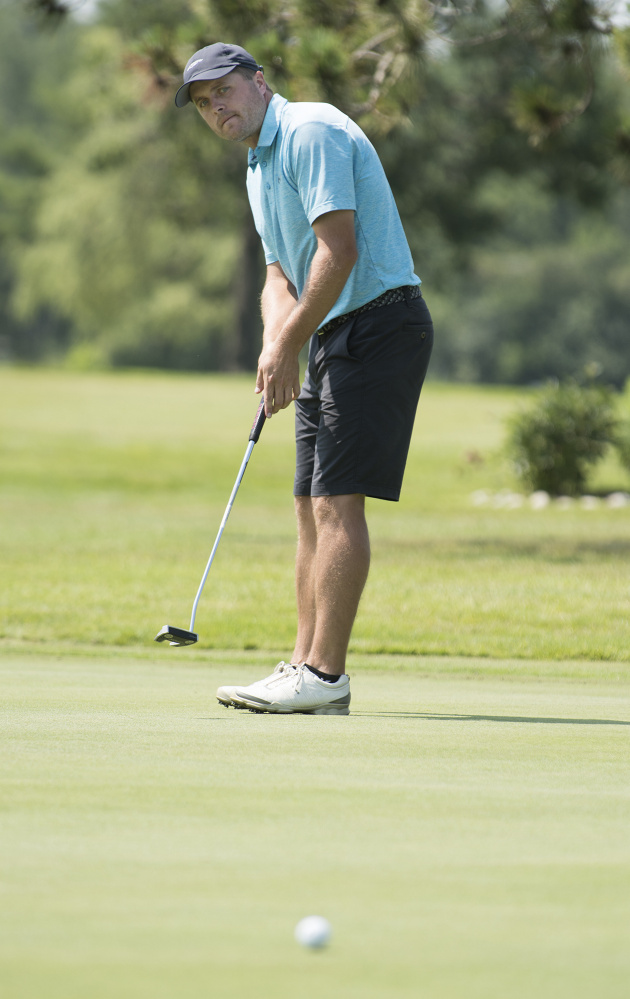 Tyler Vrolyk of Glen Allen, Virginia watches his putt on the 7th green of Bangor Municipal Golf Course on Friday.  Vrolyk is one of several golfers who are putting in long miles in order to compete in golf tournaments.