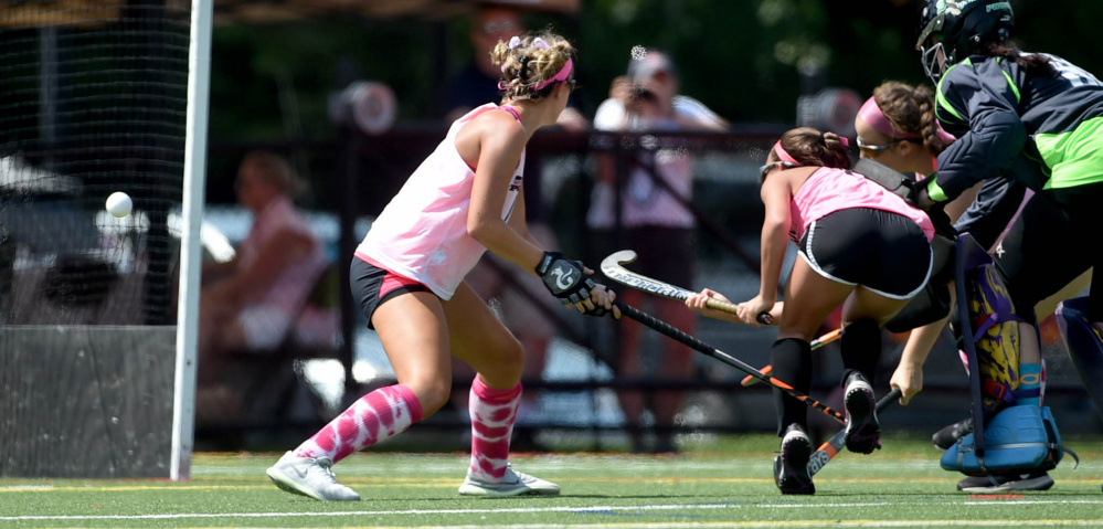 Staff photo by Michael G. Seamans 
 Skowhegan's Alexis Michonski scores against Spruce Mountain during the 7th annual Battle for Breast Cancer field hockey tournament Saturday at Thomas College in Waterville.