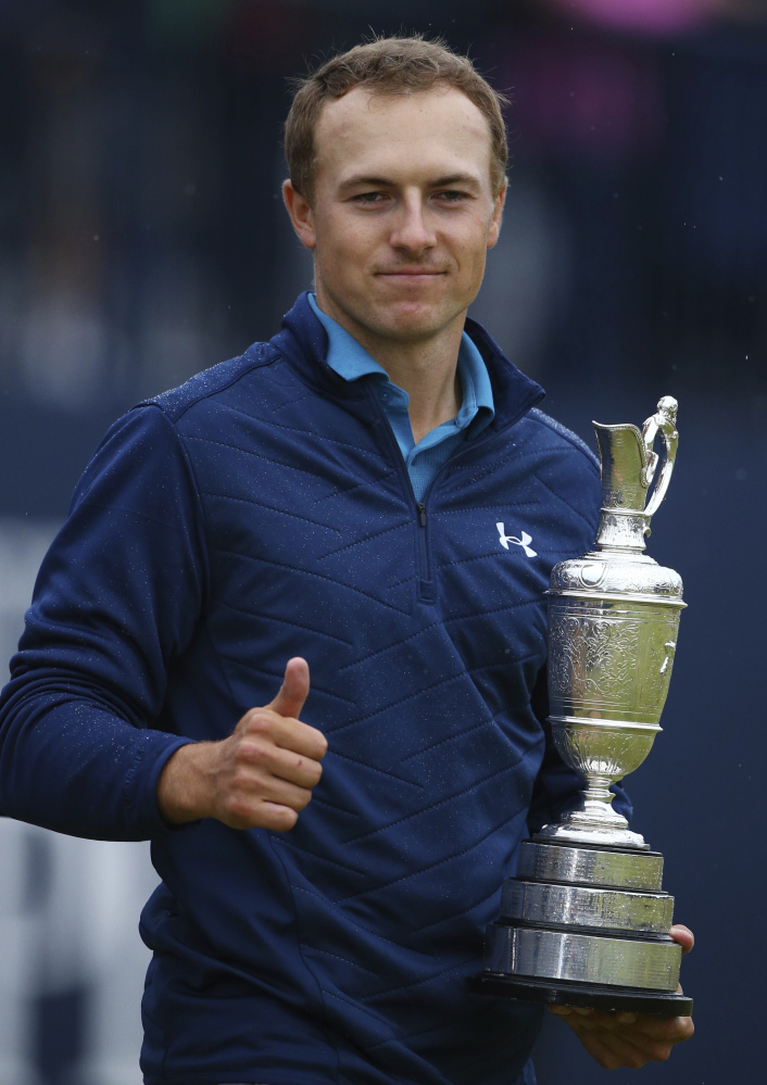 Jordan Spieth holds the trophy after winning the British Open on Sunday at Royal Birkdale, Southport, England.