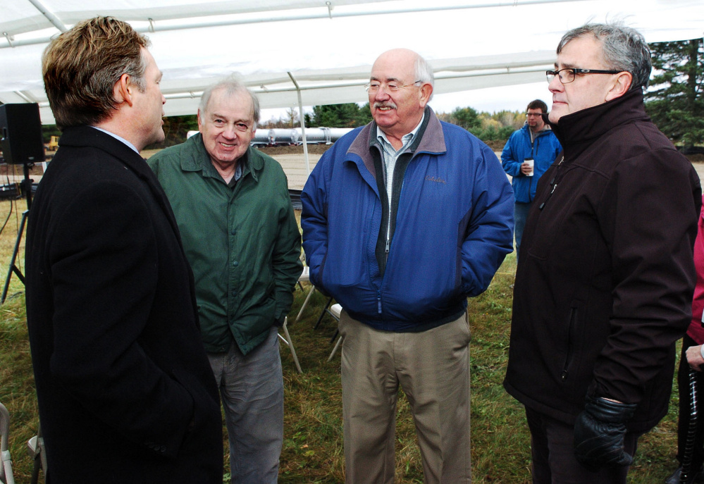 Attorney Dan Walker of Preti Flaherty, left, speaks with, from left, Elery Keene and Ken Fletcher, both of Winslow, and Gary Bowman of Oakland prior to a groundbreaking ceremony for the Fiberight solid waste facility on the Coldbrook Road in Hampden on Oct. 26, 2016. The latest edition of the Municipal Review Committee's newsletter affirms that the plant will be ready April 1, 2018, to accept waste from these two communities and 113 others that have agreed to send their waste to Hampden.