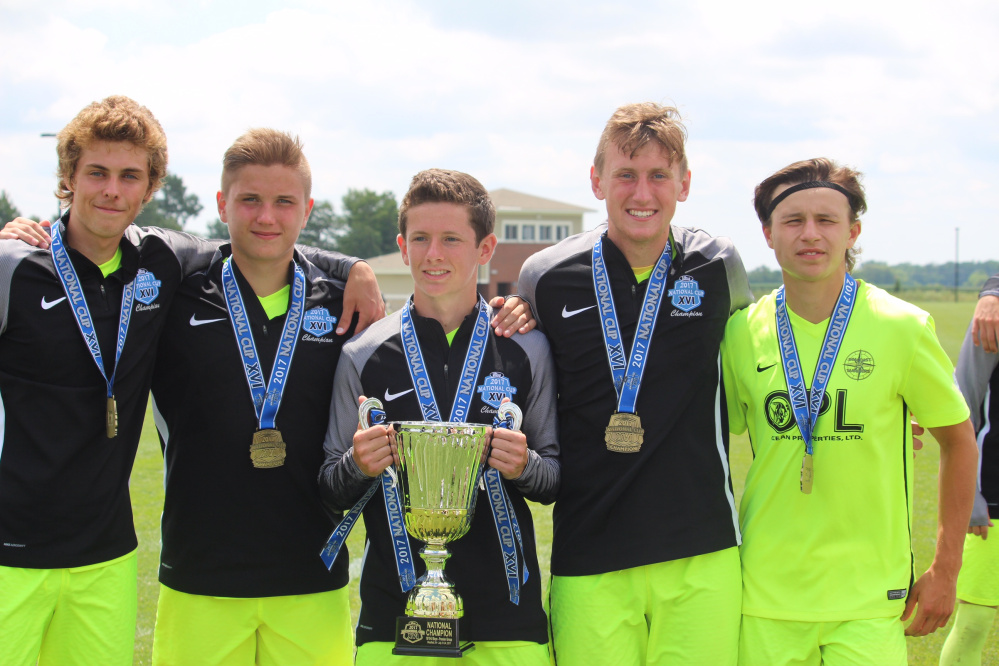 From left to right, Hayden Elwell, Mike Wildes, Jack Moore, Cole Smith and Jake Warn stand with the National Cup they won with the Seacoast United U-19 team Monday in Westfield, Indiana.