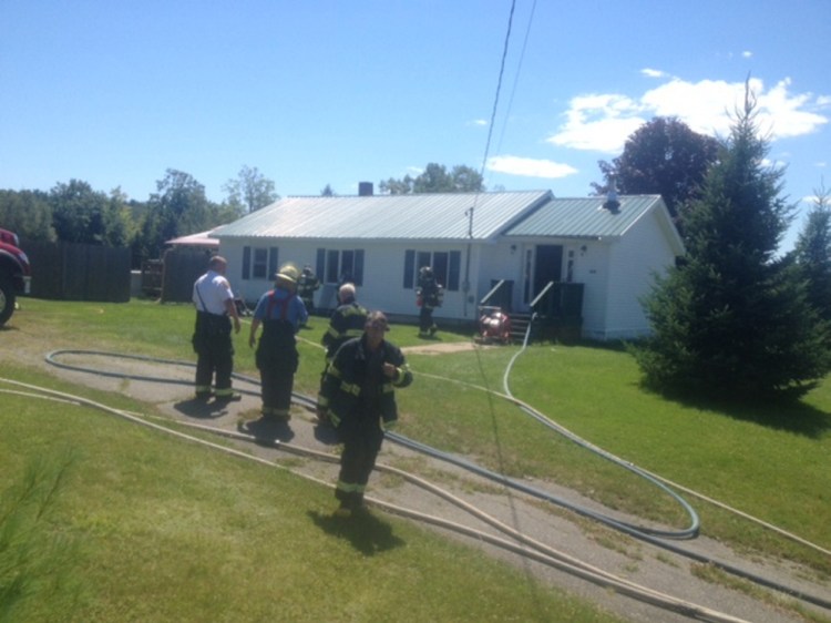 Firefighters from Skowhegan and Norridgewock converged upon this Mercer home to put out a smoky fire Wednesday.
