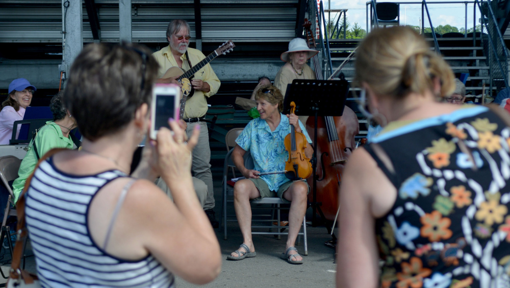 The Reel People Band takes a breather during their performance at the Maine Artisan Bread Fair at the Skowhegan Fair Grounds on Saturday, July 30, 2016. 