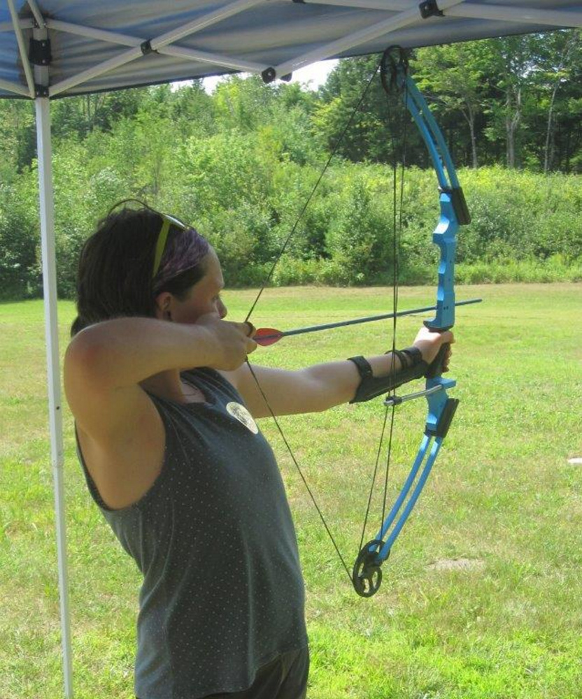 Sarah Richards works on her archery skills at Wilton Fish and Game Association.