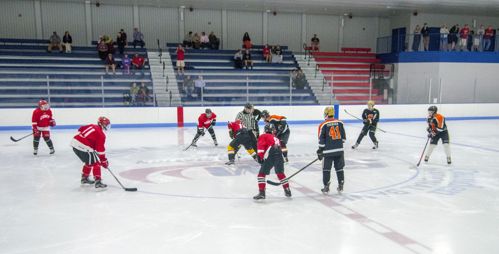 A small crowd watches the opening face off of a Gardiner vs. Cony summer league game Friday at the Camden National Bank Ice Vault in Hallowell.