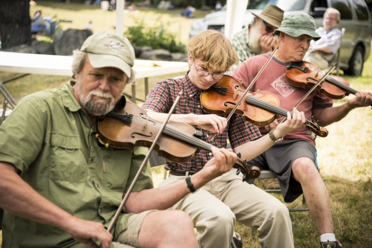 Fiddlers and musicians of all ages and skills play together at the annual East Benton Convention on Sunday. From left are: Barry Crawford, of Monroe, Joshua Rosenthal, 13, of Damariscotta and Charlie Moen, of Readfield.