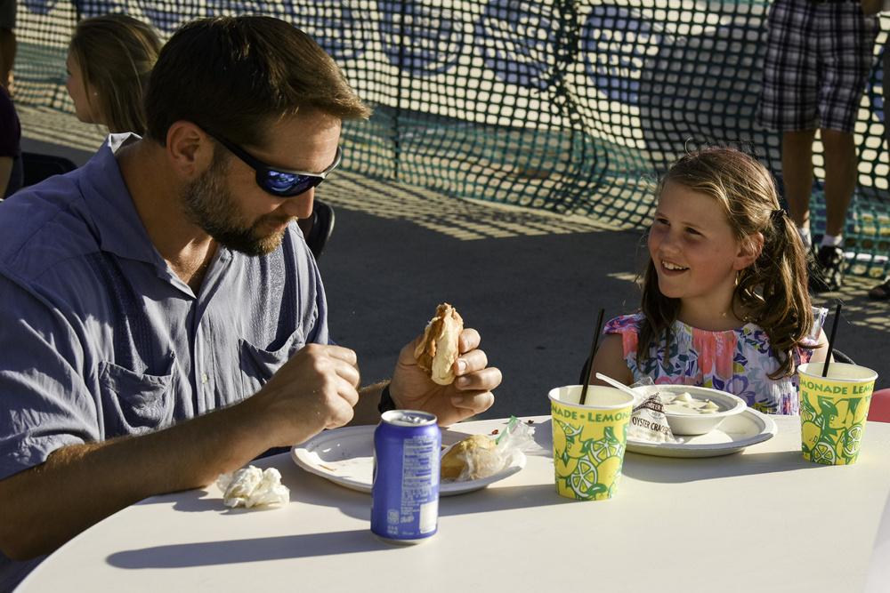 Aaron Podey and his daughter, Elliotte, of Waterville, enjoy their meal Wednesday evening at the 2016 edition of the Taste of Waterville. At the 2017 edition, the beer garden will be set up in Castonguay Square; the Bite, vendors and children's activities will be located in Haines Park in The Concourse, and restauarants will line Main Street with booths.