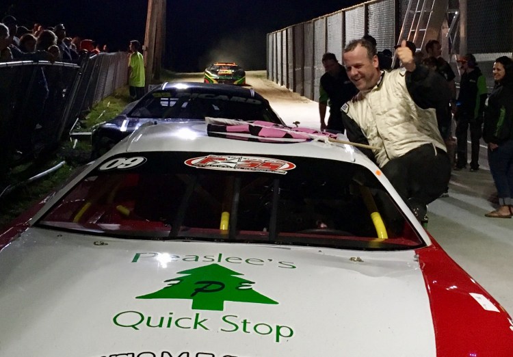 Daren Ripley of Thomaston climbs out of his car after winning the second of two Pro Stock features at Wiscasset Speedway on Saturday night.