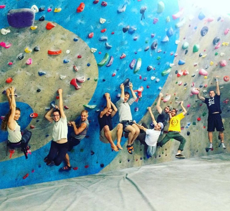 The staff of Vinland hangs out at a rock gym. On team outings colleagues can interact outside their defined roles at the Portland restaurant.