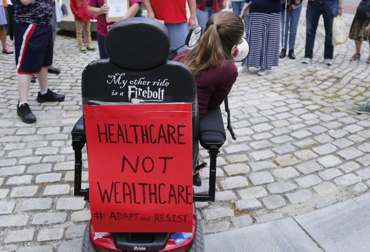 By slashing Medicaid, the Senate ACA overhaul would keep people with disabilities from living independently, says Kingsley Floyd, center. The cuts are a factor in Maine Sen. Susan Collins' opposition to the bill.