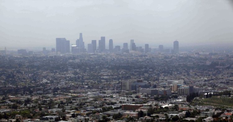 Smog covers downtown Los Angeles in 2009. Attorneys general from 15 states and the District of Columbia are suing over the Trump administration's delay of Obama-era rules reducing emissions of smog-causing air pollutants.