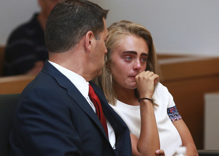 Michelle Carter awaits her sentencing in a courtroom in Taunton, Mass., on Thursday for involuntary manslaughter for encouraging Conrad Roy III to kill himself in July 2014. Carter was sentenced to 15 months in jail for involuntary manslaughter.