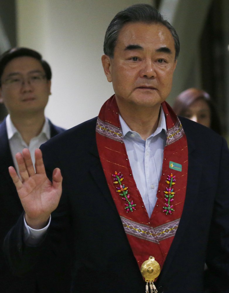 Chinese Foreign Minister Wang Yi arrives at an Association of Southeast Asian Nations meeting Saturday in Manila, Philippines. On Sunday he urged North Korea to cease missile and nuclear tests.