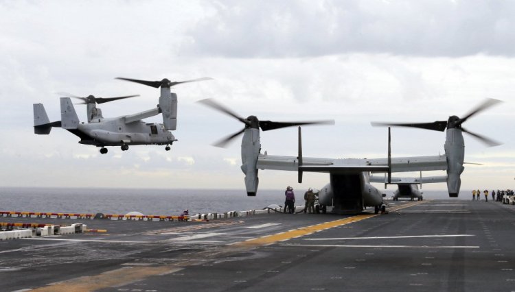 U.S. Marine MV-22B Osprey aircraft land on the deck of the USS Bonhomme Richard amphibious assault ship off the coast from Sydney in June. An MV-22 Osprey that had launched from the USS Bonhomme was conducting regularly scheduled operations when it crashed into the water off Australia's east coast Saturday.