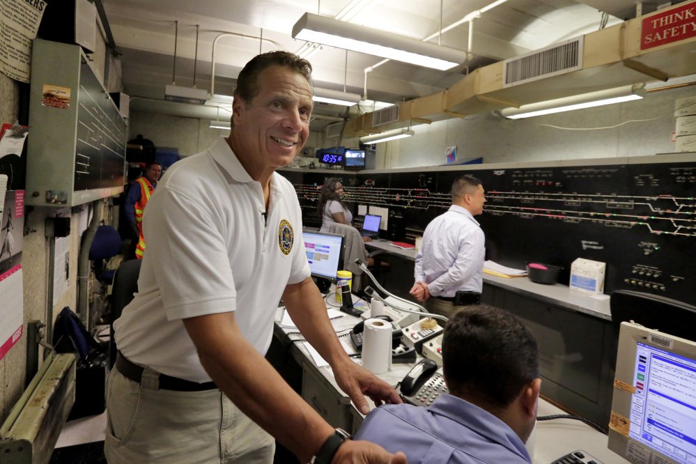 New York Gov. Andrew Cuomo visits the subway control room under the Columbus Circle subway station in New York, durning a media tour, Wednesday, Aug. 9, 2017.  Cuomo on Wednesday promised that the system's power provider, Con Edison, is now working with the Metropolitan Transportation Authority, which runs the subway system, on fixes and upgrades that will reduce delays substantially. (AP Photo/Richard Drew)