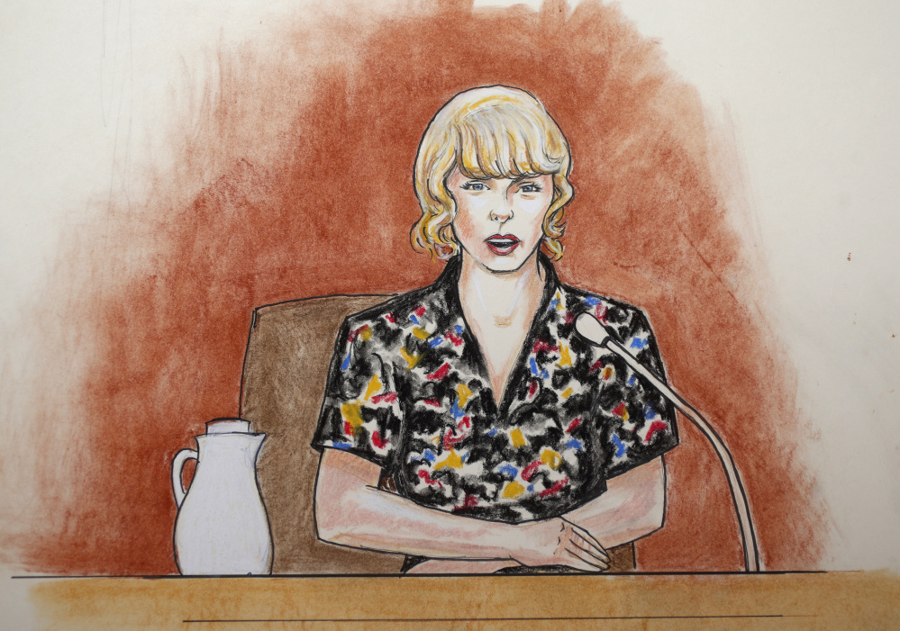 In this courtroom sketch, pop singer Taylor Swift speaks from the witness stand Thursday in Denver. 