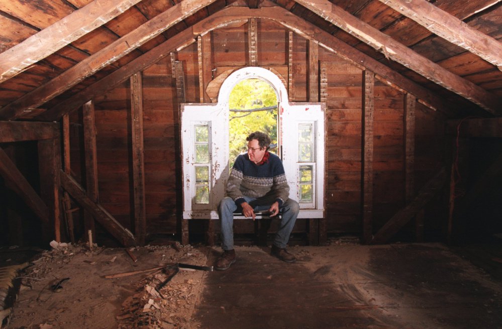 In this Oct. 20, 1997 photo, Chandler Saint ponders the daunting task of restoring the attic study of the Beecher House in Litchfield, Conn. Taken apart and stored in pieces, the house where Harriet Beecher Stowe grew up is for sale on eBay, with an asking price of $400,000. Museums passed on the building, and the owner went to the online auction site after finding no takers on Craigslist.