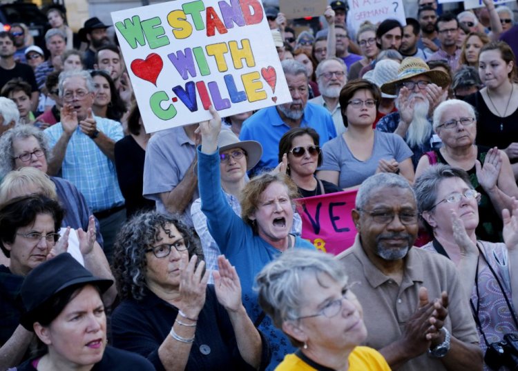 People cheer while listening to a speaker at an event Aug. 13 in Monument Square called "Portland Maine Stands in Solidarity with Charlottesville." Events in Boston, Charlottesville and other cities have shown that counter-rallies are often larger than the rallies they are denouncing.