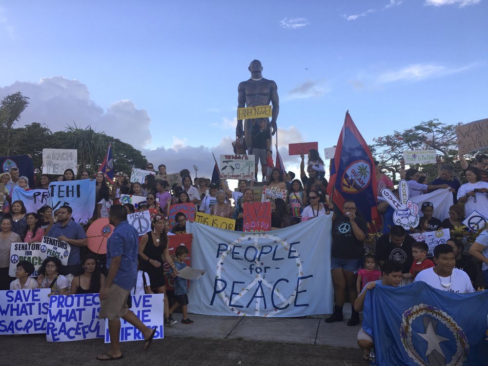 About 100 people gather at Chief Kepuha Park in Hagatna, Guam, for a rally for peace Monday. The U.S. territory has been the subject of threats from North Korea in its escalating war of words with President Trump's administration.
