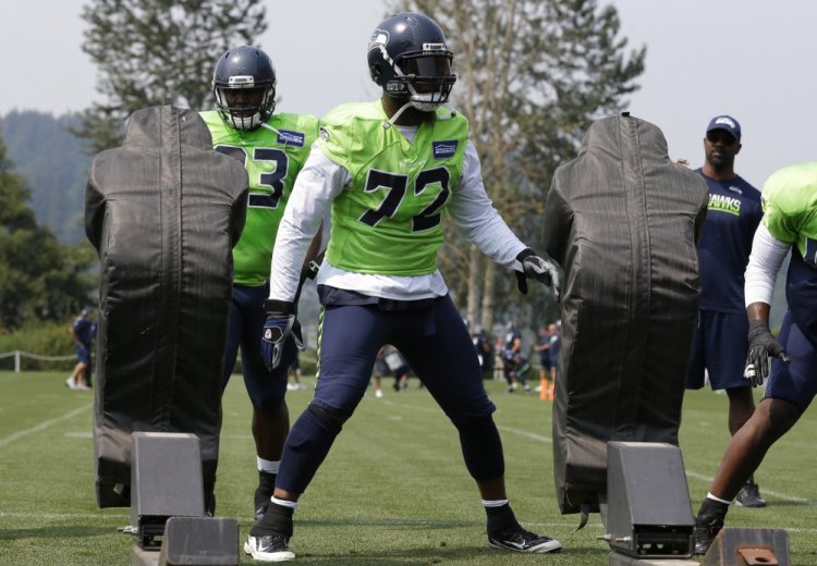 Defensive end Michael Bennett of the Seattle Seahawks said he plans to sit during the national anthem this season to draw attention to social injustice.