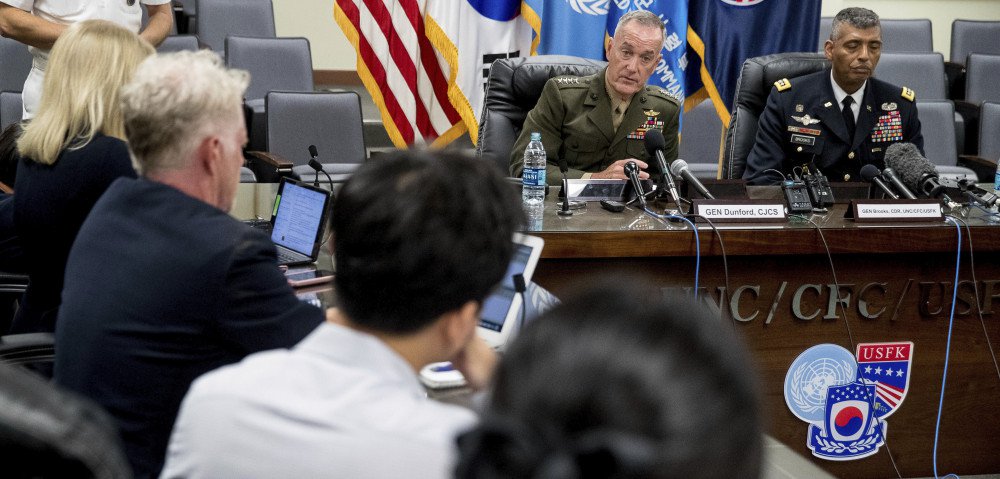 Joint Chiefs Chairman Gen. Joseph Dunford, center rear, accompanied by United States Forces Korea Commander Gen. Vincent Brooks, right, speaks at a news conference at U.S. Army Garrison Yongsan, Seoul, South Korea, Monday, Aug. 14, 2017.  The top U.S. military officer is warning during a trip to Seoul that the United States is ready to use the "full range" of its military capabilities to defend itself and its allies from North Korea. A spokesman says Marine Corps Gen. Dunford also told his South Korean counterparts Monday that the North's missiles and nukes threaten the world. (AP)