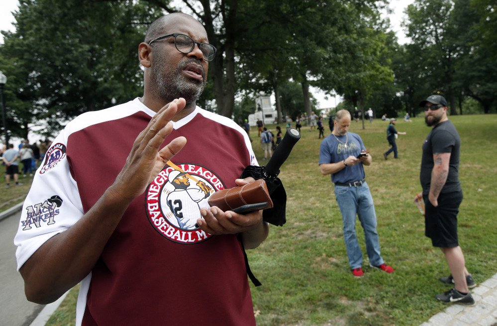 Former Boston Celtics star Cedric Maxwell stands on Boston Common. Maxwell, a current member of the Celtics radio broadcast crew, planned to participate in the counterprotest to the midday "free speech" rally.
