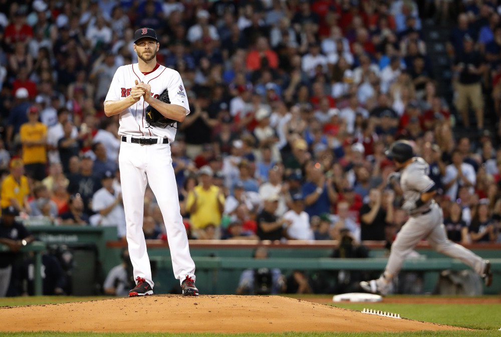 Boston starting pitcher Chris Sale stands on the mound as Tyler Austin of the Yankees rounds the bases after his three-run home run during the second inning of a baseball game at Fenway Park in Boston Saturday, Aug. 19, 2017.