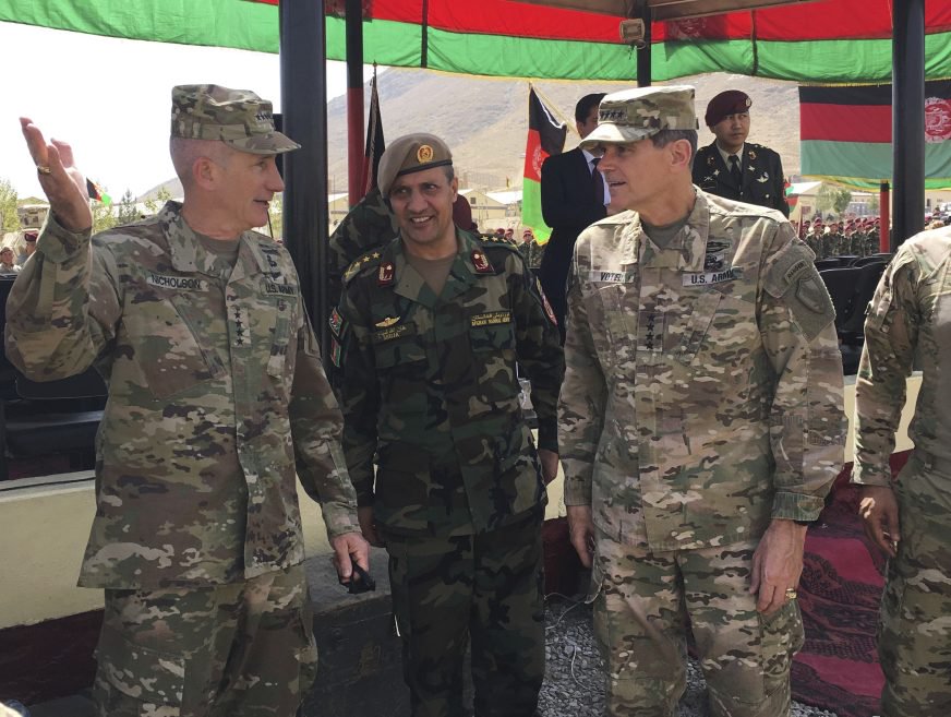 U.S. Gen. John Nicholson, top U.S. commander in Afghanistan, left, talks with Col. Khanullah Shuja, commander of the national mission brigade of the Afghan special operations force, and U.S. Gen. Joseph Votel, head of U.S. Central Command, at Camp Morehead in Afghanistan on Sunday.