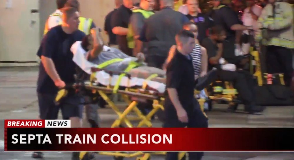 A victim is wheeled away from the scene of a train crash in Upper Darby, Pennsylvania, on Tuesday, when a commuter train crashed into a parked train at the suburban Philadelphia terminal.