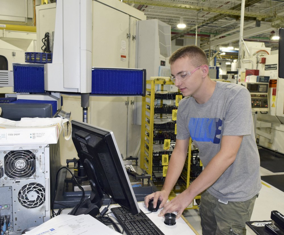 Tom Teague works at Pratt & Whitney's North Berwick plant after an internship as part of a collaboration with Thornton Academy. "This is my first job. I'm glad I did it." he said.