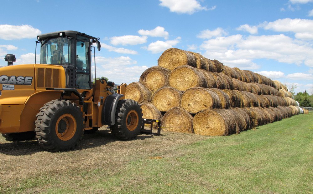 Bales of hay that have been donated for a lottery drawing to help drought-stricken farmers and ranchers are stacked Tuesday at a site near the North Dakota State University campus in Fargo. About 900 ranchers in the Dakotas and Montana have applied for the hay lottery.
