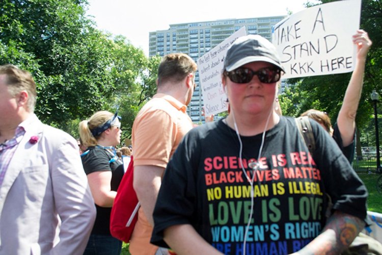 Angela King, above, and Tony McAleer, left, participate in a counter-protest during what was billed as a "Free speech" rally in Boston on Aug. 19. King, a former neo-Nazi who went to prison at 23 for three years for a hate crime, co-founded the nonprofit Life After Hate. According to the SPLC, membership in hate groups has risen over the last two years.