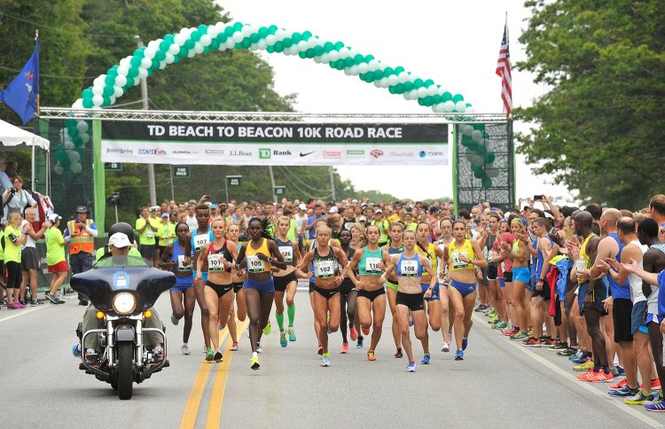 The elite women runners cross the starting line at the Beach to Beacon on Aug. 5, 2017.