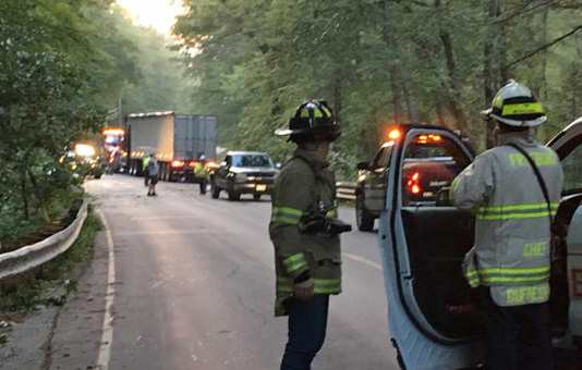 Firefighters on the scene of a tanker truck crash in Fryeburg Tuesday morning.
