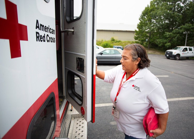 Red Cross volunteer Corina Hamlin of Brownville prepares to head south from Portland with another volunteer to help victims of Hurricane Harvey. They  delivered a Red Cross emergency response vehicle, an ambulance-like truck that can carry food, cots and other supplies into disaster areas.