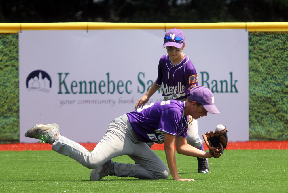 Waterville center fielder Spencer Brown makes a snow-cone catch in front of Ben Foster during a Cal Ripken 11U New England regional quarterfinal game Tuesday against Barrington, New Hampshire at Purnell Wrigley Field in Waterville. Waterville won 8-1.