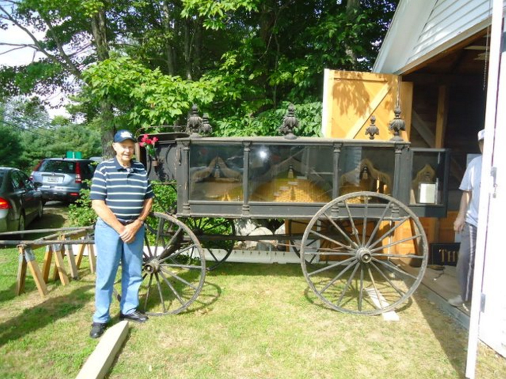 Ralph Bond stands beside his grandfather's (S.H. Bond) 1800's horse-drawn hearse which will be on display at the Saturday, Aug. 5 Open House and Exhibit Day at the Old Jefferson Town House.