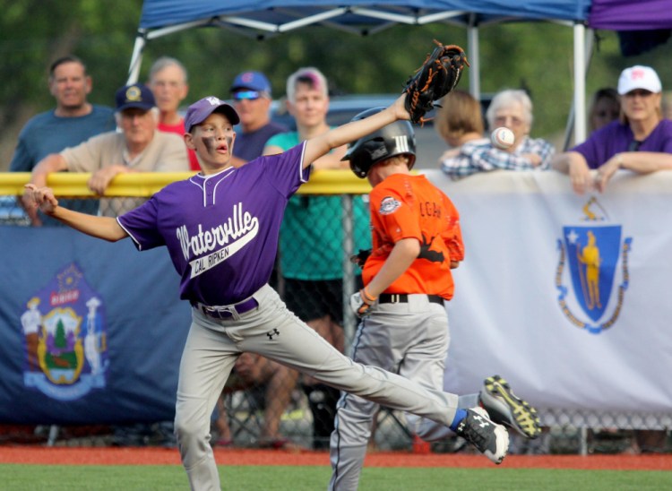 Waterville second baseman Wyatt Gradie is unable to coral an errant throw allowing Brunswick, Maine's Miles Logan to reach first base in a Cal Ripken 11U Regional Tournament semifinal Wednesday at Purnell Wrigley Field in Waterville.