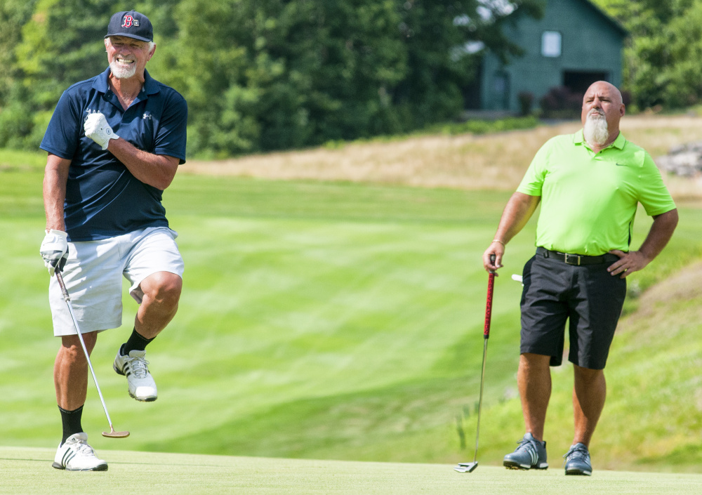 Bill Lee, left, grimaces after just missing a putt as Ray Haskell watches during the Ray Haskell Ford MLB Players Alumni Association golf fundraiser Thursday at Belgrade Lakes Golf Course in Belgrade.