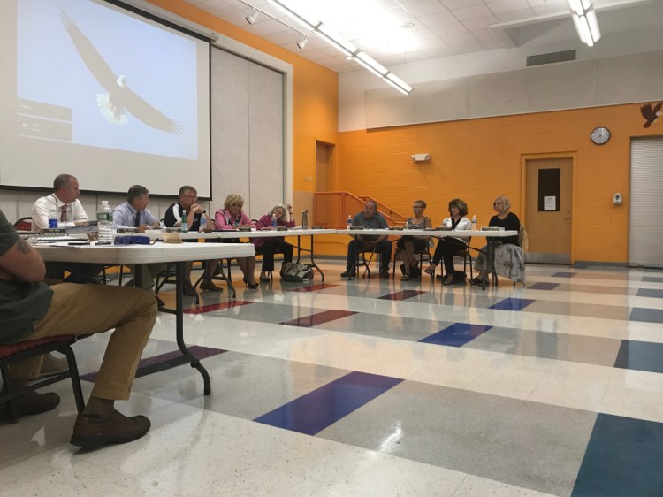 The RSU 18 school board discusses a motion related to a proposed $13.9 million facilities bond on Wednesday in Oakland.
