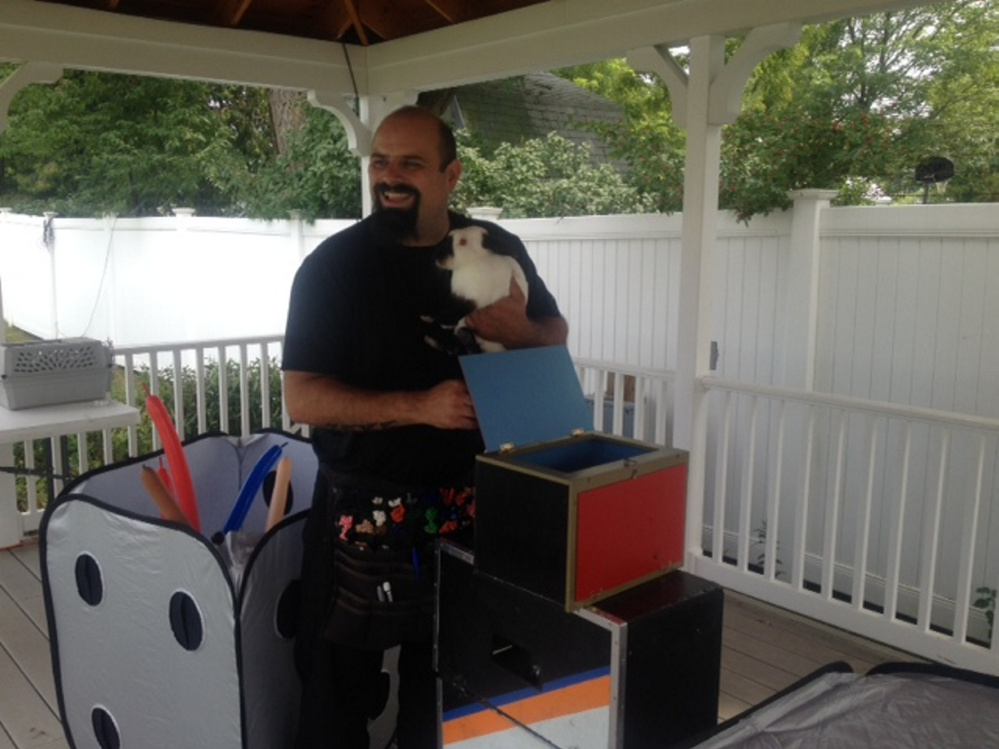 Conjuring Carroll Chapman, of Embden, waits with his magic rabbit, Buster, for his audience to arrive Friday at the Skowhegan State Fair.